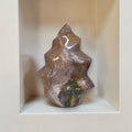 Flame-shaped ocean jasper stone with brown, purple, and green veining