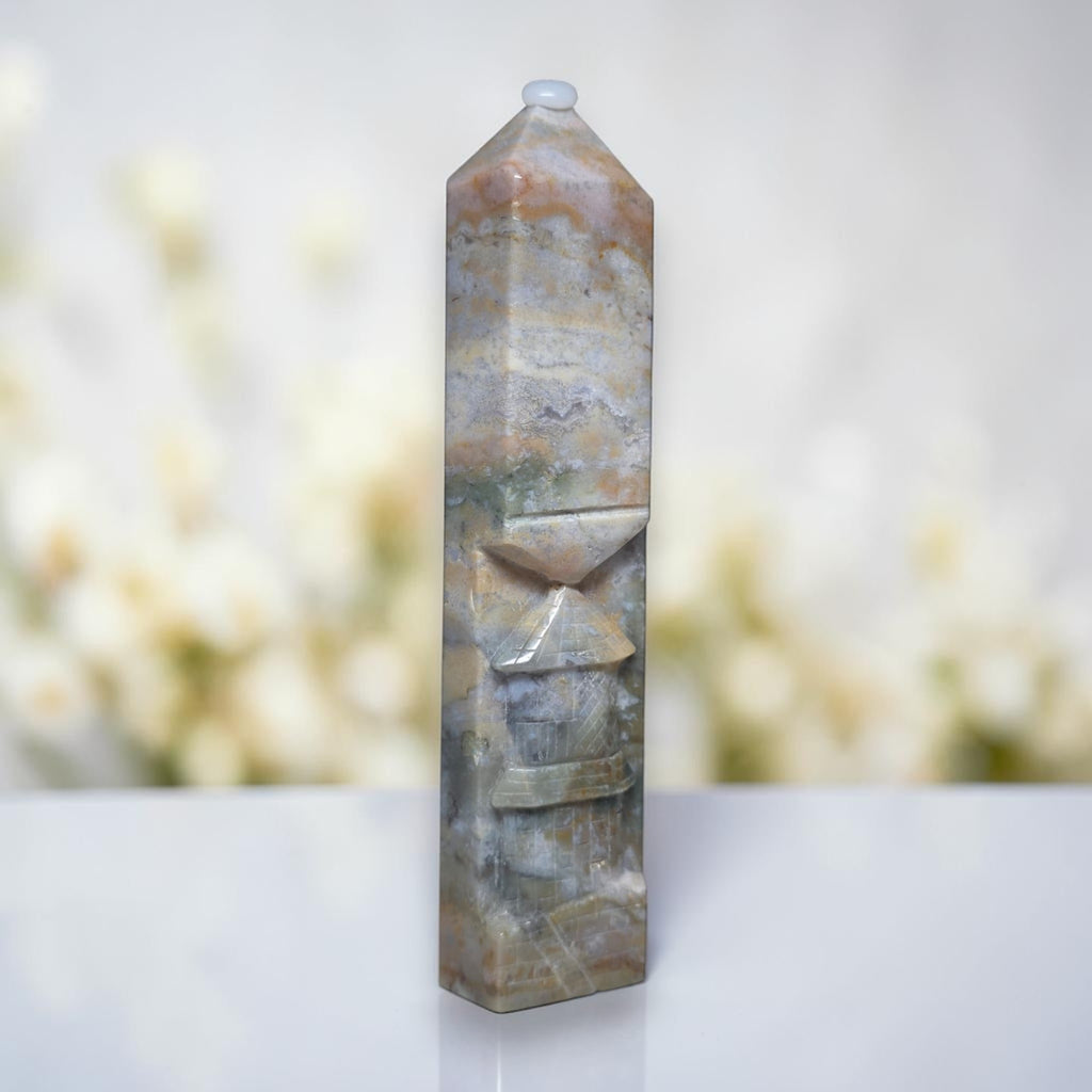 Ocean jasper tower with rounded top, swirled blue-gray and tan pattern with carved lines