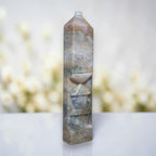 Ocean jasper tower with rounded top, swirled blue-gray and tan pattern with carved lines