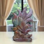 Ocean jasper nine-tail fox crystal carving angled view with flowing tails on base