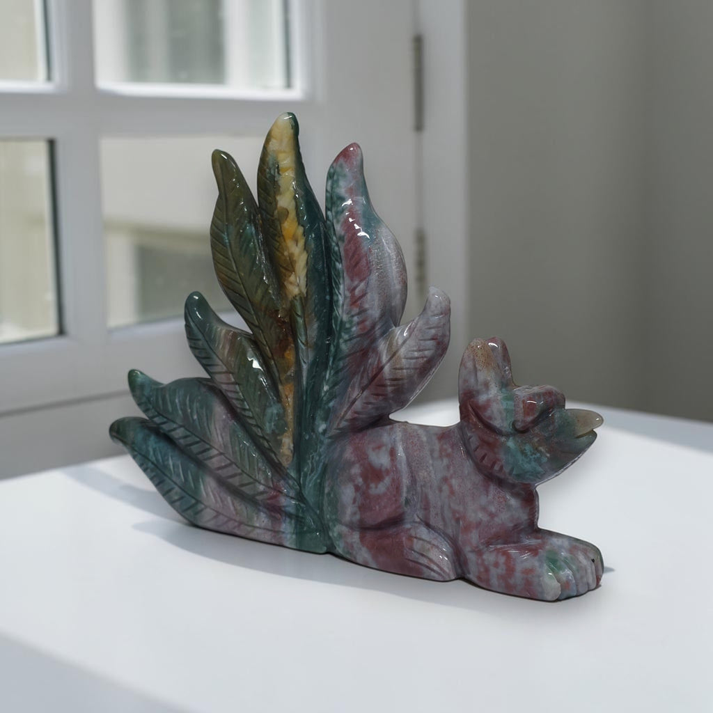 Side view of polished ocean jasper nine tailed fox