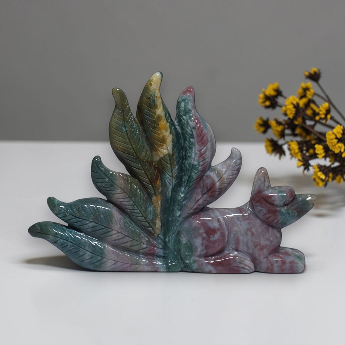 Ocean jasper fox sculpture in home decor setting