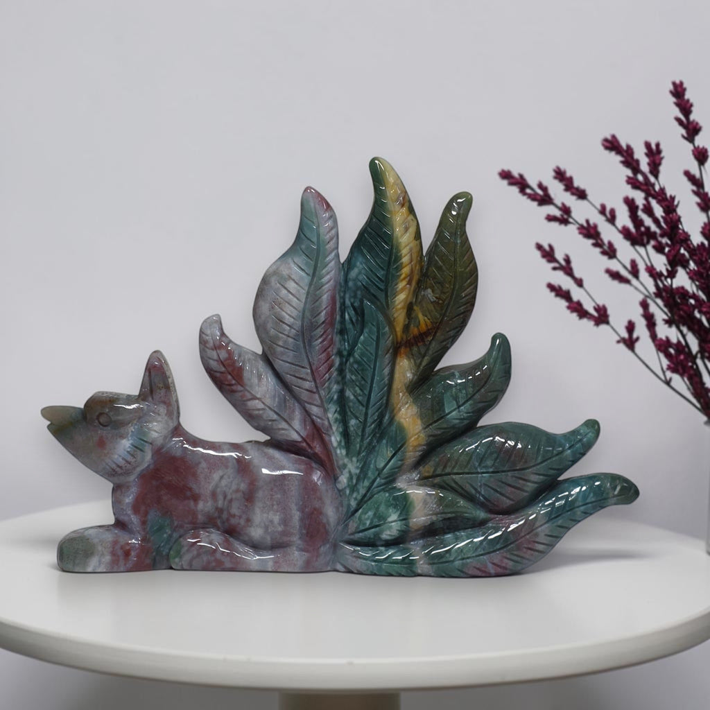Ocean jasper fox carving displayed on a shelf