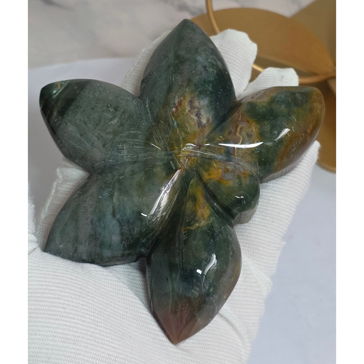 Close view of the hand carved Ocean Jasper orchid petals