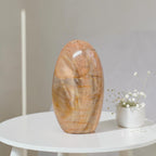 Polished peach moonstone freeform crystal, smooth oval stone.