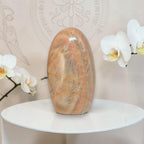 Polished peach moonstone freeform crystal, smooth rounded oval stone.