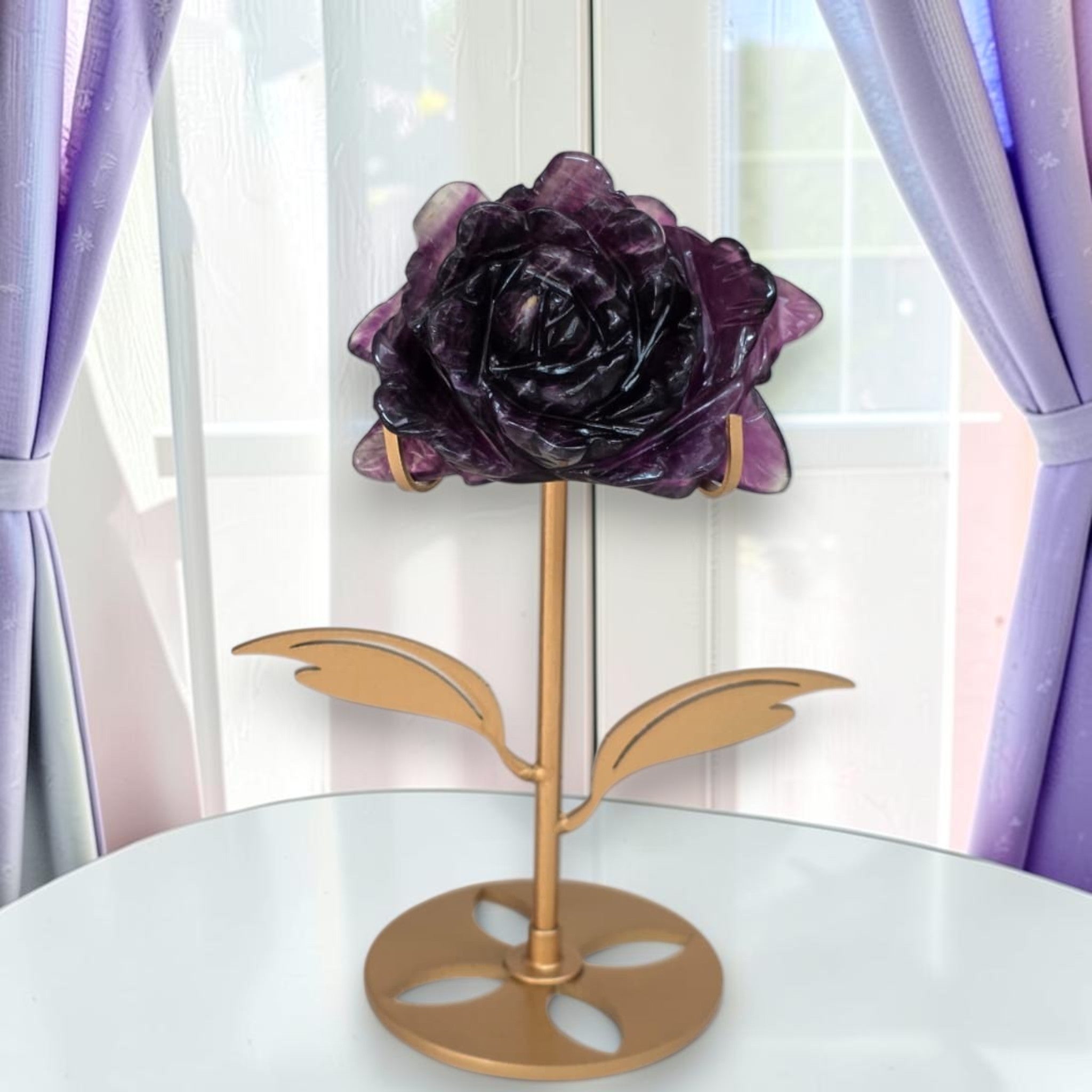 Purple fluorite rose carving on gold stand, front view