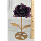 Purple fluorite rose on gold stand with ruler showing approximately 7 inches tall