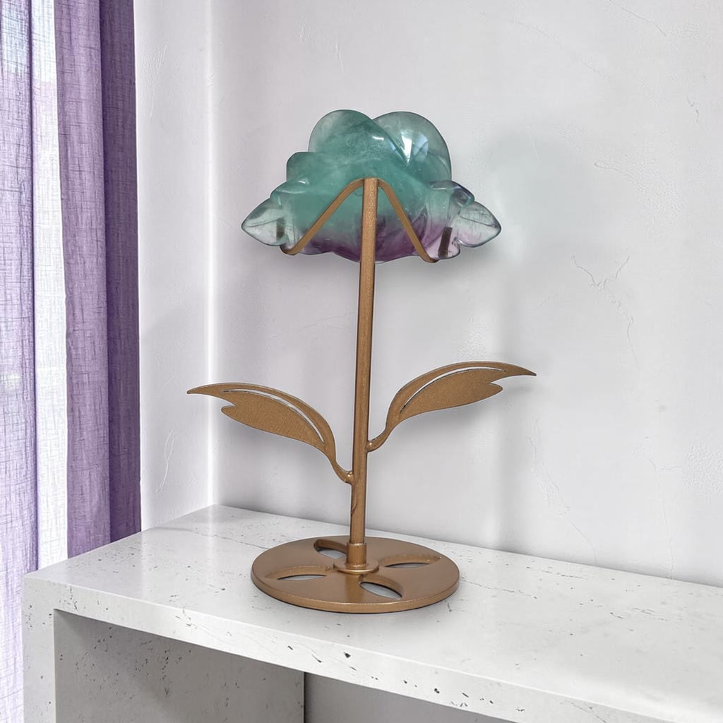 Rainbow fluorite rose carving on gold stand, back view