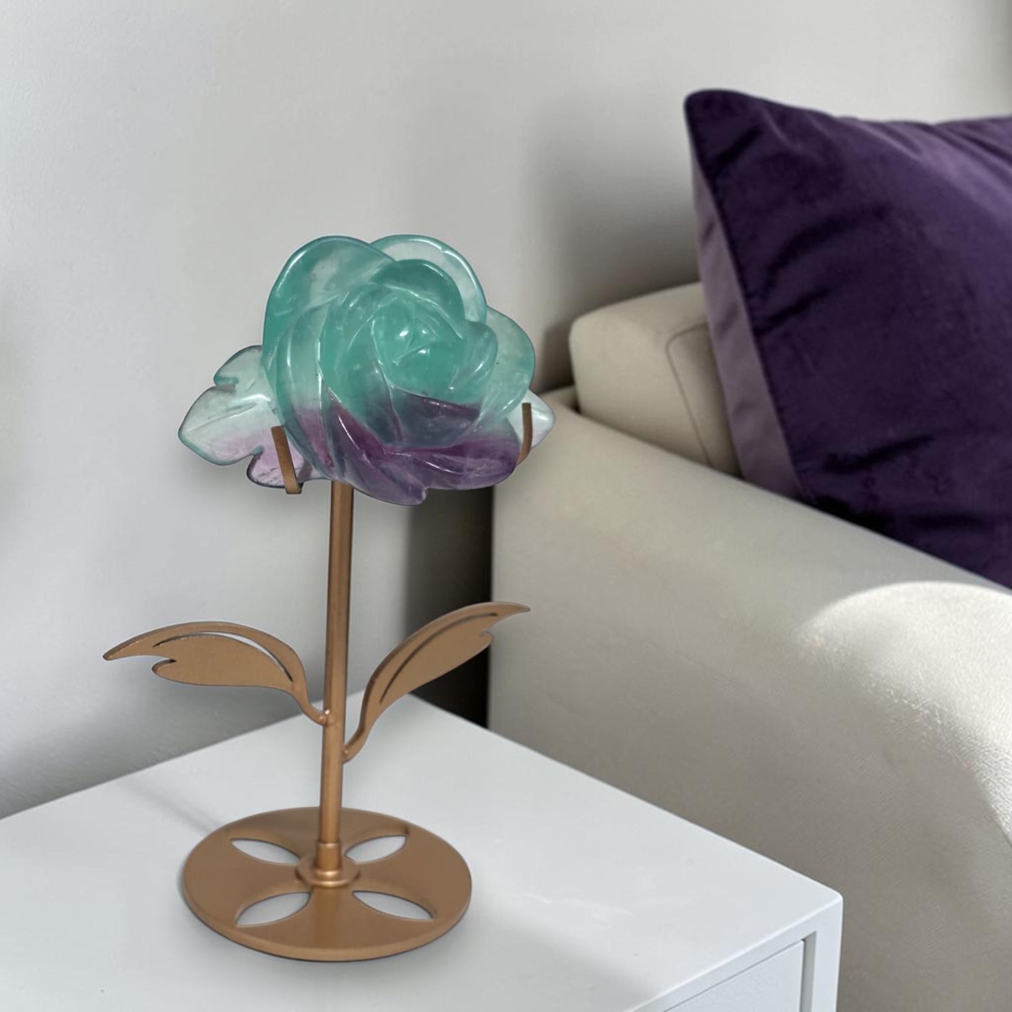 Rainbow fluorite rose on gold stand in living room shelf decor