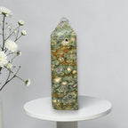 Rainforest jasper druzy tower, green-and-brown stone with tan druzy-like spots and gray pits