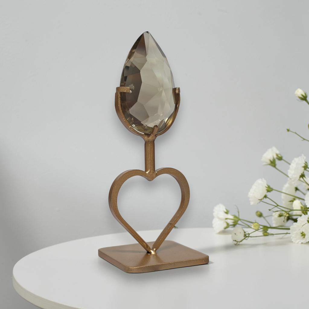 Smoky quartz heart stand displayed with white flowers