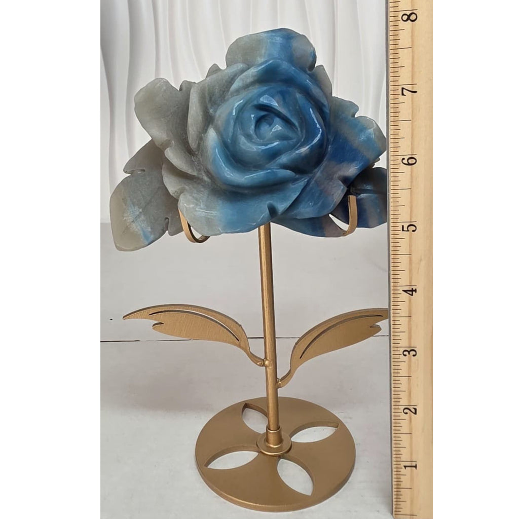 Natural Trolleite rose carving on gold flower stand next to ruler showing approximately 7 inches tall