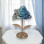 Natural Trolleite rose carving on gold stand, top-down view showing petal detail and indigo center