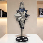 Silver and dark blue agate star carving on tall black stand, multi-faceted